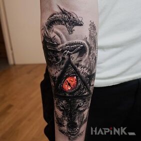 Tattoo Dragon eye on the forearm motif: dragons style: realistic