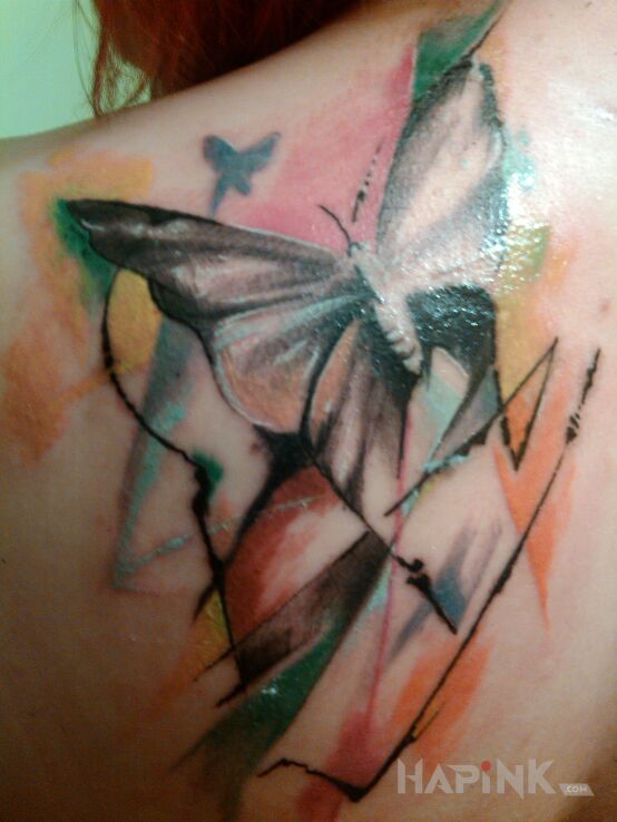 Tattoo Motyl in butterflies motif on the shoulder blades