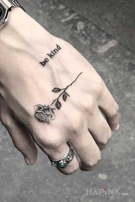 Tattoo Bądź miły in black and gray motif and graphic / illustrative style on the hand