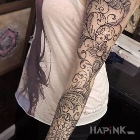 Tattoo Ornaments and mandalas in the sleeve on the forearm motif: black and gray style: graphic / illustrative
