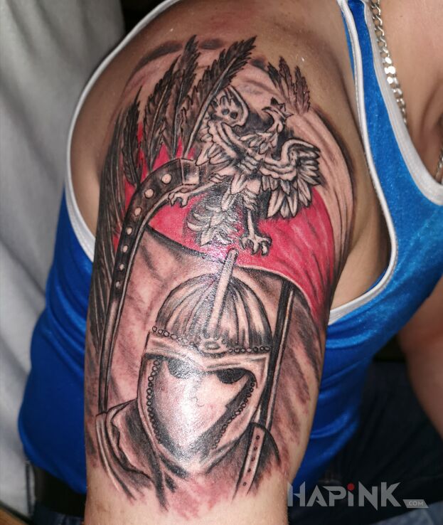 Tattoo Husaria in patriotic motif and graphic / illustrative style on the upper arm