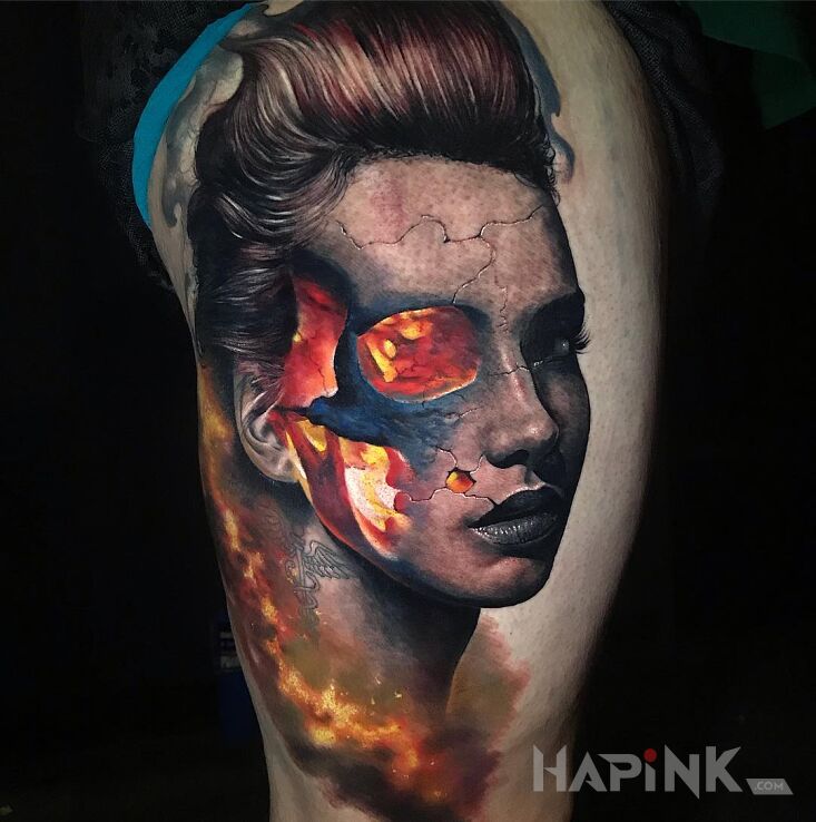 Tattoo Ogień w głowie in faces motif and realistic style on the leg