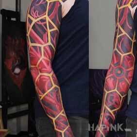 Tattoo Red hornbeam on the upper arm motif: colorful style: abstract