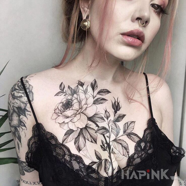 Tattoo Kwiatek na klatce in black and gray motif and graphic / illustrative style on the breast
