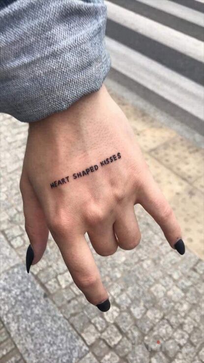 Tattoo Heart in lettering motif and calligraphy style on the hand