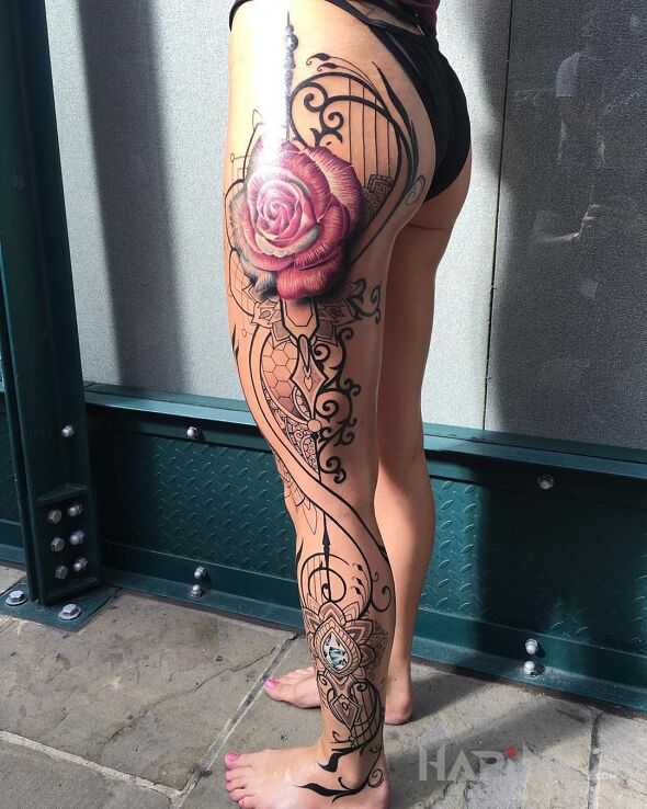 Tattoo Ornamenty na nodze in ornaments motif and realistic style on the calf