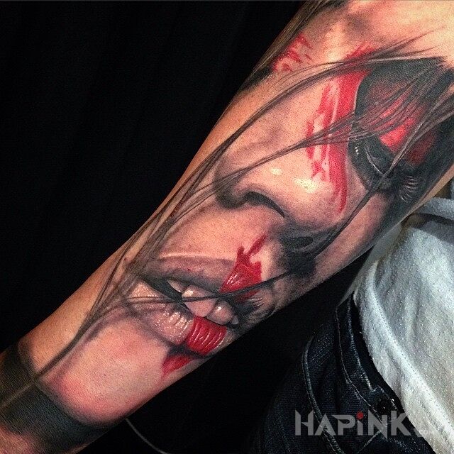 Tattoo Portret dziewczyny in faces motif and realistic style on the forearm
