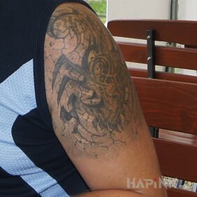 Tattoo Scorpion 3D on the upper arm motif: black and gray style: realistic