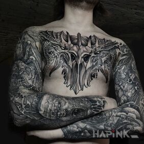 Tattoo Demonic filth on the collarbone motif: black and gray style: graphic / illustrative