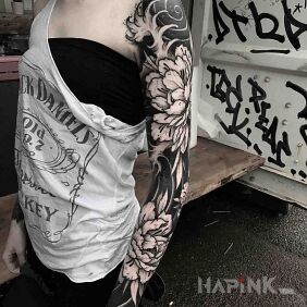 Tattoo Two chrysanthemums on the forearm motif: flowers style: japanese / irezumi