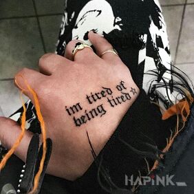Tattoo Tired because tired xD on the hand motif: lettering style: calligraphy