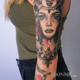 Tattoo Trash Polka portrait on the upper arm motif: butterflies style: trash polka