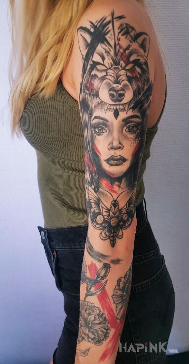 Tattoo Trash Polka portret in flowers motif and trash polka style on the forearm