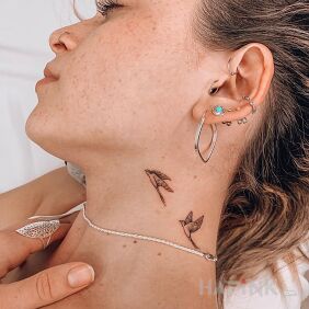 Tattoo Two birds on the neck motif: black and gray style: minimalistic