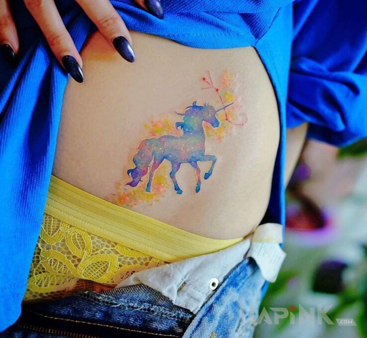 Tattoo Jednorozec in fantasy motif and Watercolor style on the stomach