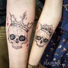 Tattoo Crowned skulls on the forearm motif: skulls style: graphic / illustrative