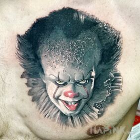 Tattoo Pennywise on the chest motif: demons style: realistic