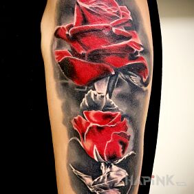 Tattoo Roses on the upper arm motif: flowers style: graphic / illustrative