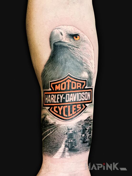 Tattoo HARLEY DAVIDSON in animals motif and realistic style on the forearm