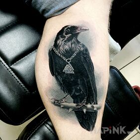 Tattoo Raven on the calf motif: black and gray style: realistic