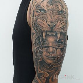 Tattoo Tiger part2 on the upper arm motif: black and gray style: realistic