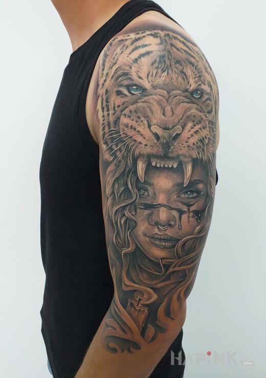 Tattoo Tygrys cz2 in animals motif and realistic style on the upper arm