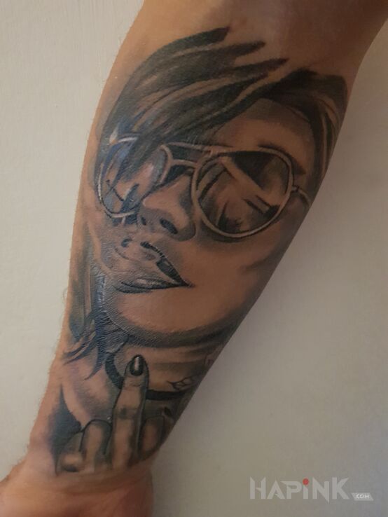 Tattoo Nice Girls in black and gray motif and realistic style on the forearm