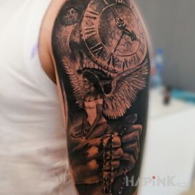 Tattoo Everyone has a good and bad angel who participates in all our lives on the upper arm motif: black and gray style: realistic