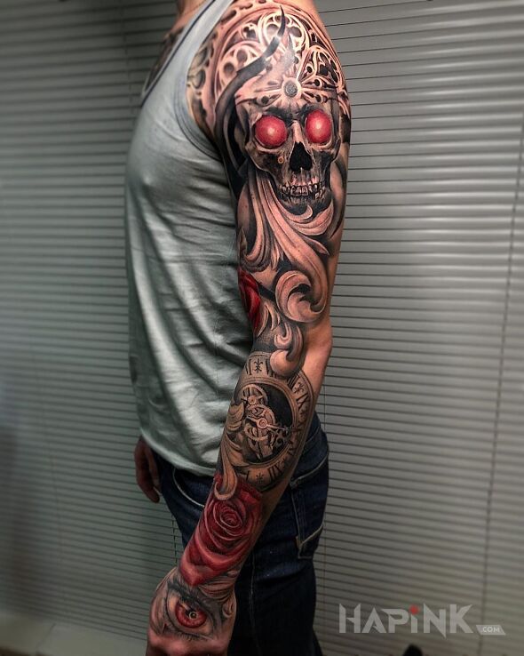 Tattoo Czerwone oczy w czaszce in skulls motif and realistic style on the forearm
