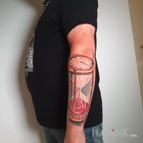 Tattoo Hourglass on the forearm motif: objects style: realistic