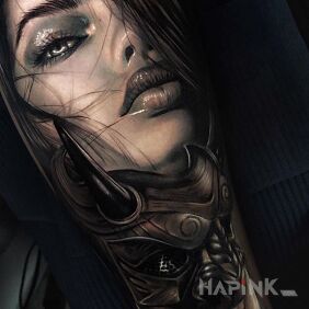 Tattoo A woman's face on the forearm motif: black and gray style: realistic