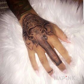 Tattoo Trump bombshell on the hand motif: black and gray style: graphic / illustrative