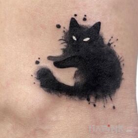 Tattoo Kitten near the ankle motif: animals style: blackwork / blackout