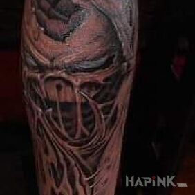 Tattoo Alien on the calf motif: ripped skin style: graphic / illustrative