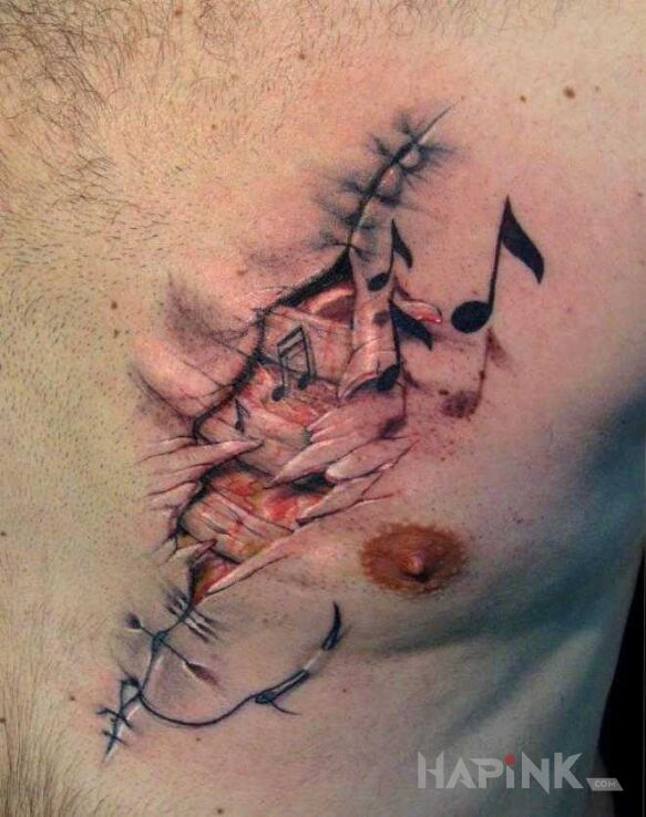 Tattoo Muzyczne serce in colorful motif and realistic style on the chest
