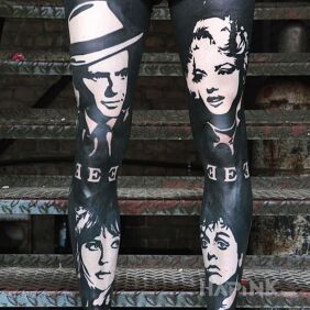 Tattoo Black legs on the tibia motif: faces style: blackwork / blackout