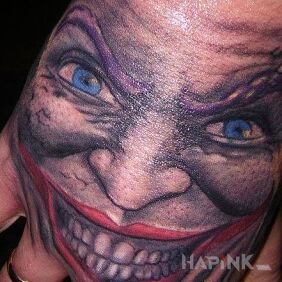 Tattoo Joker on the hand motif: characters