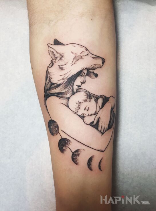 Tattoo Wilcza opieka in black and gray motif and graphic / illustrative style on the forearm