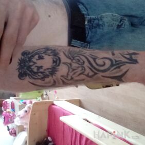 Tattoo Tribal on the forearm motif: animals style: tribal