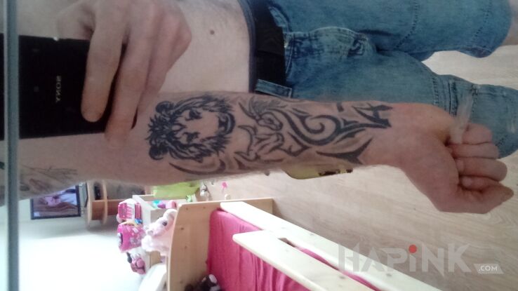 Tattoo Tribal  in zodiac signs motif and tribal style on the forearm
