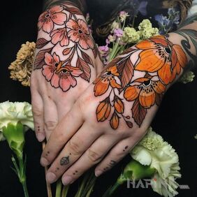 Tattoo What pretty flowers on the hand motif: colorful style: graphic / illustrative