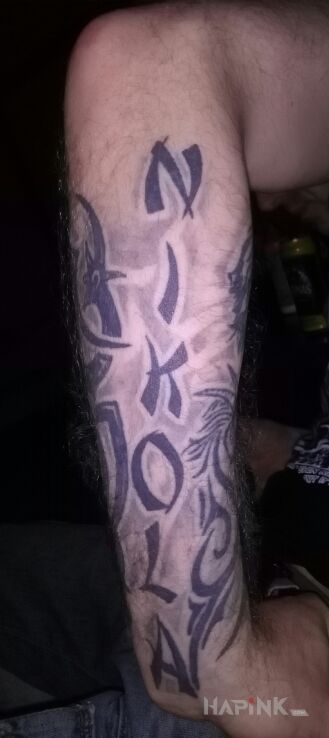 Tattoo Napis in lettering motif on the forearm