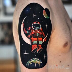 Tattoo Astronaut on the upper arm motif: cosmos