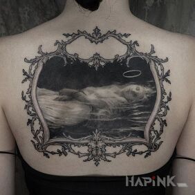 Tattoo Woman in the frame on the back motif: black and gray style: graphic / illustrative