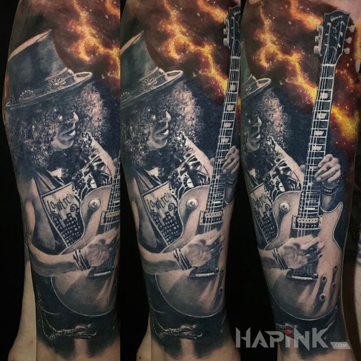 Tattoo Solówka Slasha in black and gray motif and realistic style on the calf