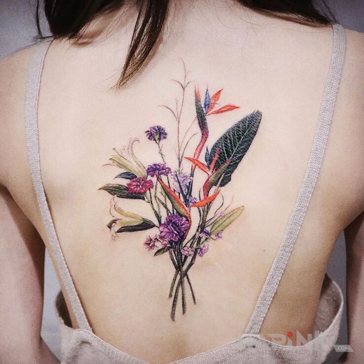 Tattoo Bukiet in flowers motif and realistic style on the back