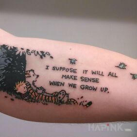 Tattoo Where is the sense? on the upper arm motif: lettering style: graphic / illustrative