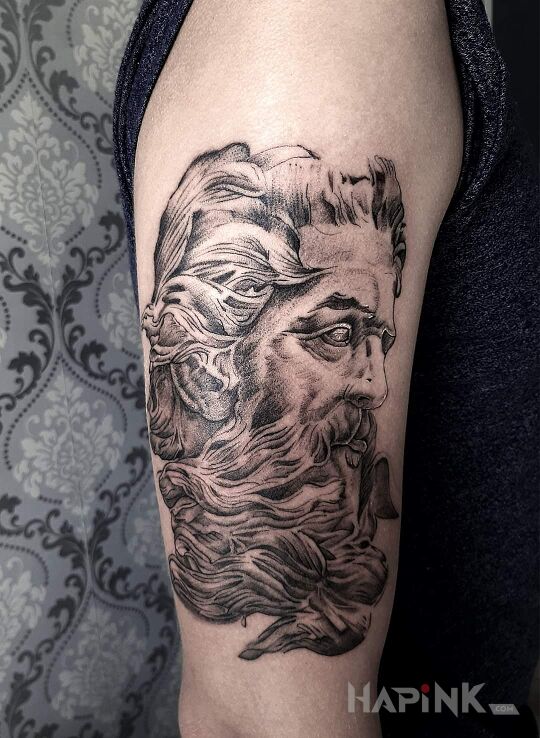Tattoo A teraz zeusik in faces motif and graphic / illustrative style on the upper arm