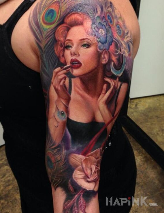 Tattoo Portret in characters motif and realistic style on the upper arm
