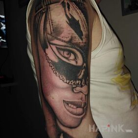 Tattoo Woman on the upper arm motif: faces